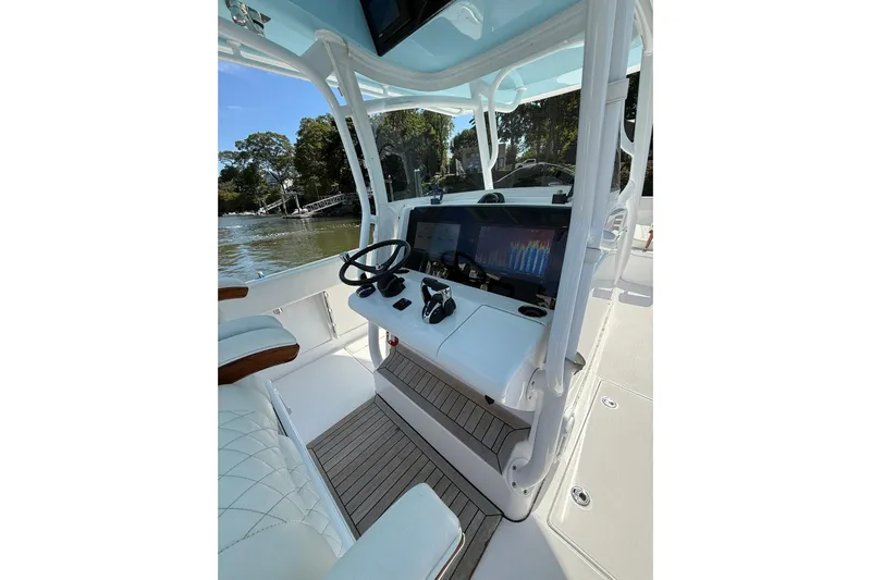  Yacht Photos Pics 2021 Jupiter 38 HFS boat helm with modern controls and navigation display.