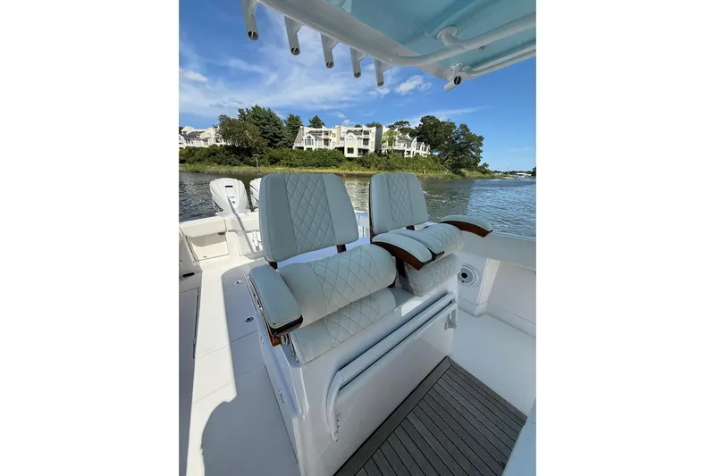  Yacht Photos Pics Luxury seating on 2021 Jupiter 38 HFS boat, with scenic waterfront view.