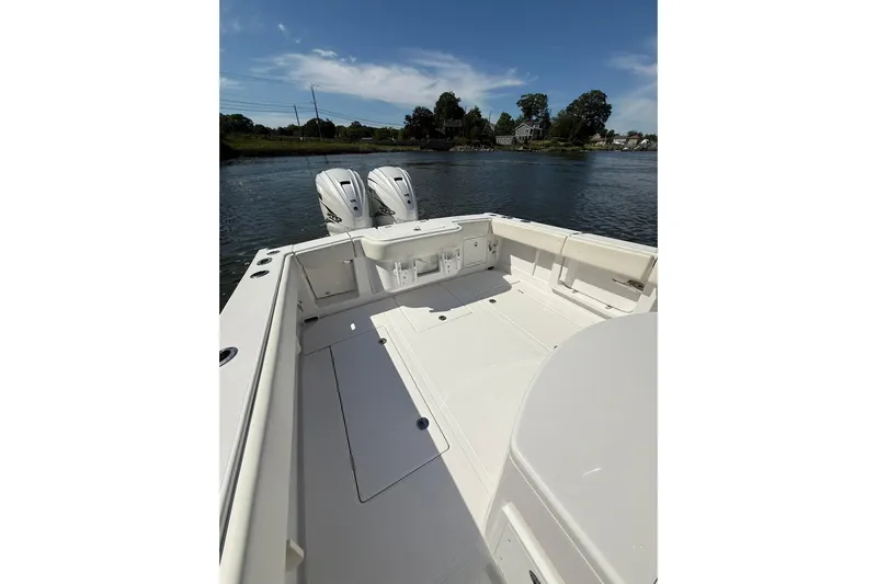  Yacht Photos Pics 2021 Jupiter 38 HFS boat with dual engines on a calm waterway.