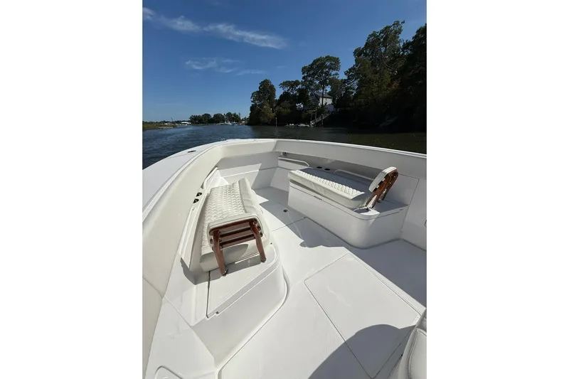  Yacht Photos Pics 2021 Jupiter 38 HFS boat interior with seating, cruising on a sunny day.