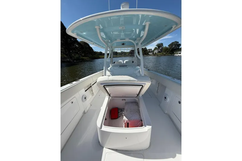  Yacht Photos Pics 2021 Jupiter 38 HFS boat interior with open storage compartment on a sunny day.