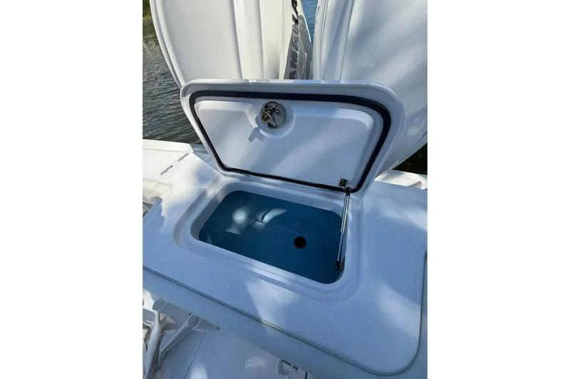  Yacht Photos Pics Open storage compartment on 2021 Jupiter 38 HFS boat, showing interior details.