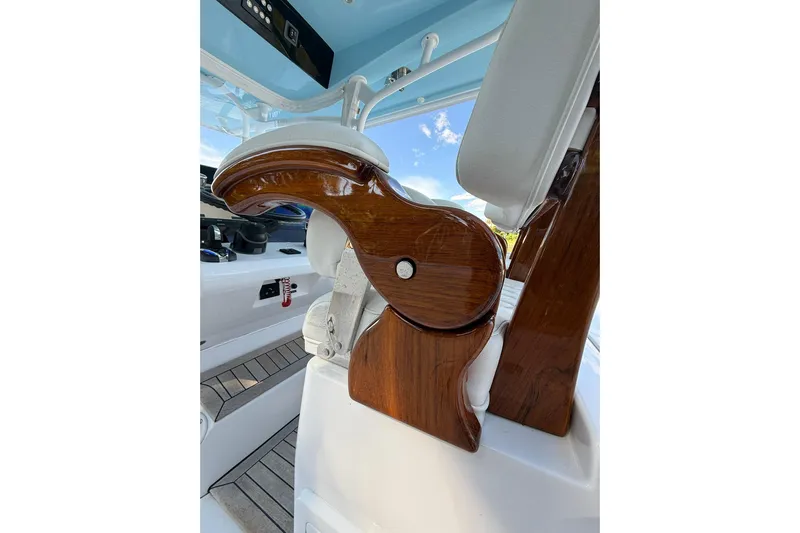  Yacht Photos Pics Luxurious interior of 2021 Jupiter 38 HFS boat with polished wood and white seating.