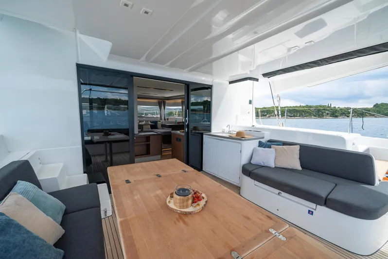 Spellbound Yacht Photos Pics Luxurious Lagoon 50 yacht interior with spacious seating and dining area, 2023 model.