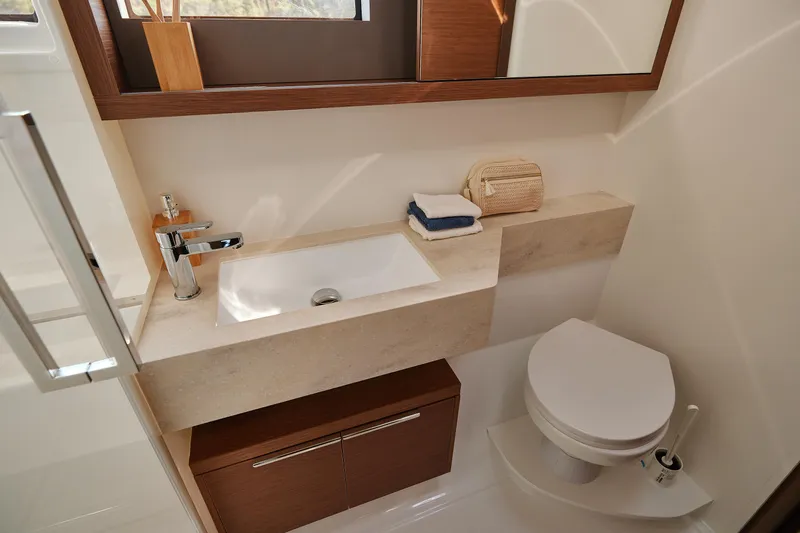 Spellbound Yacht Photos Pics Modern bathroom in 2023 Lagoon 50 yacht with sleek sink and toilet design.