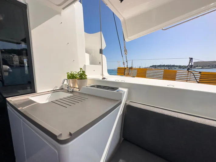 Spellbound Yacht Photos Pics 2023 Lagoon 50 yacht deck with seating and ocean view.