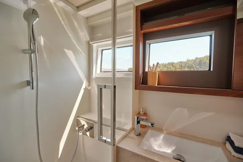Spellbound Yacht Photos Pics Modern bathroom in 2023 Lagoon 50 yacht with shower and sink.