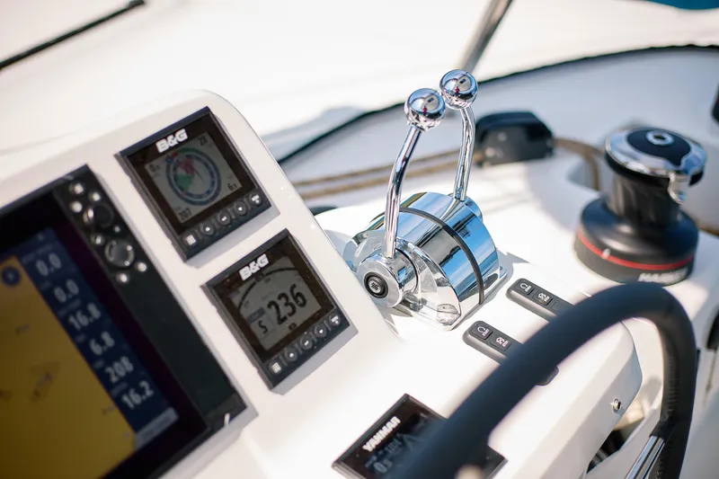 Spellbound Yacht Photos Pics 2023 Lagoon 50 yacht cockpit with navigation instruments and throttle controls.