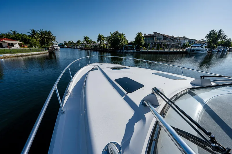 Annie Yacht Photos Pics Intrepid 475 Sport Yacht 2014 cruising in scenic waterfront area.