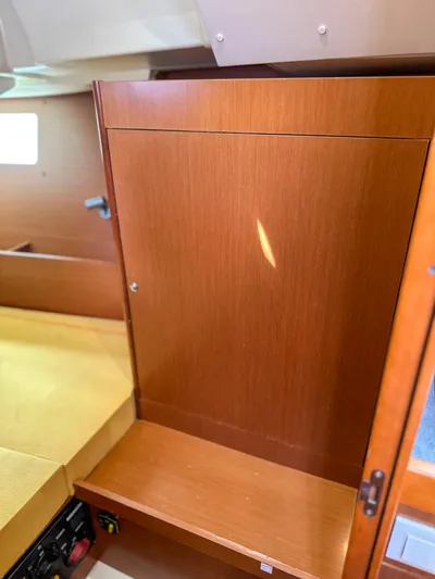 Sadalbari Yacht Photos Pics Interior of 2018 Beneteau Oceanis 41.1 yacht with wooden cabinetry and seating area.