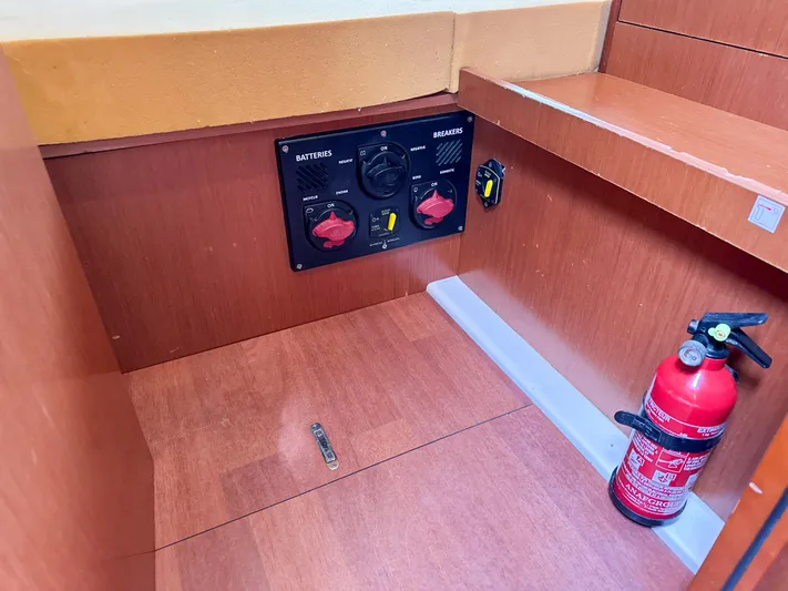 Sadalbari Yacht Photos Pics Electrical panel and fire extinguisher on 2018 Beneteau Oceanis 41.1 yacht interior.