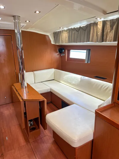 Sadalbari Yacht Photos Pics Interior of 2018 Beneteau Oceanis 41.1 yacht with white seating and wooden finish.