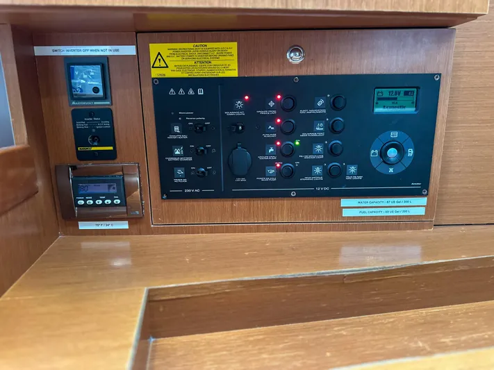 Sadalbari Yacht Photos Pics Control panel of a 2018 Beneteau Oceanis 41.1 sailboat, featuring various switches and displays.