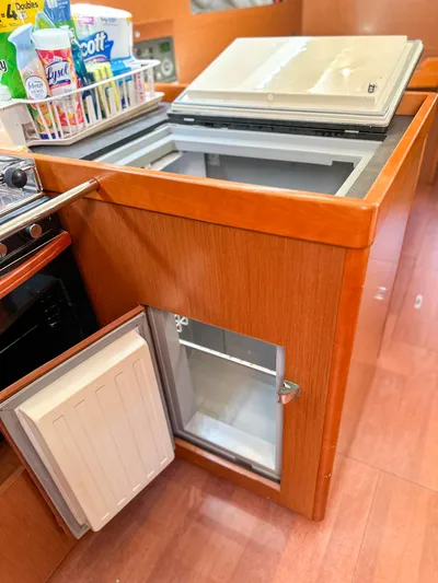 Sadalbari Yacht Photos Pics Galley kitchen in 2018 Beneteau Oceanis 41.1 yacht with open fridge and storage.