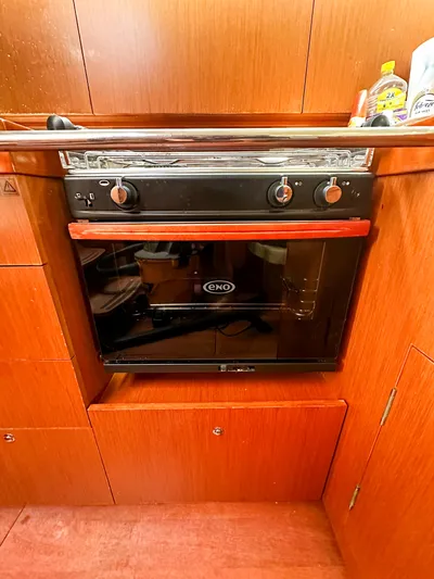 Sadalbari Yacht Photos Pics Beneteau Oceanis 41.1 2018 yacht kitchen with ENO oven and wooden cabinetry.