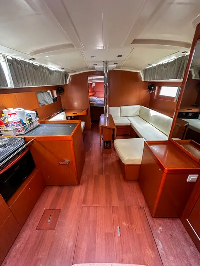Sadalbari Yacht Photos Pics Interior of 2018 Beneteau Oceanis 41.1 yacht with wood finish and cozy seating area.