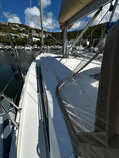 Sadalbari Yacht Photos Pics 2018 Beneteau Oceanis 41.1 sailboat docked in a marina, sunny day, clear skies.