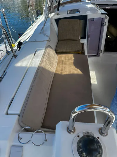 Sadalbari Yacht Photos Pics 2018 Beneteau Oceanis 41.1 yacht cockpit with cushioned seating and navigational equipment.