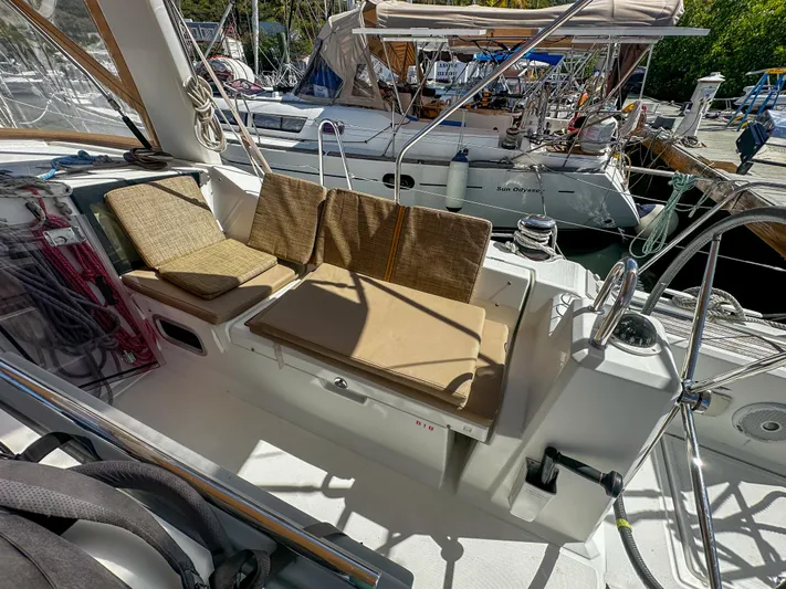 Sadalbari Yacht Photos Pics Cockpit of 2018 Beneteau Oceanis 41.1 sailboat with cushioned seating and steering wheel.