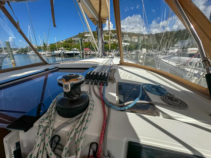 Sadalbari Yacht Photos Pics 2018 Beneteau Oceanis 41.1 sailboat deck with ropes and winch in a marina setting.
