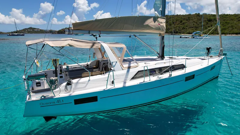 Sadalbari Yacht Photos Pics 2018 Beneteau Oceanis 41.1 sailboat anchored in clear turquoise waters.