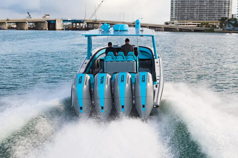  Yacht Photos Pics 2024 Midnight Express 37' Open boat with four powerful engines cruising on water.