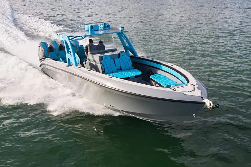  Yacht Photos Pics 2024 Midnight Express 37' Open boat cruising on water, featuring sleek design and vibrant blue accents.