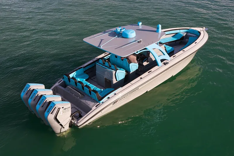  Yacht Photos Pics 2024 Midnight Express 37' Open boat with blue accents and four powerful engines on water.