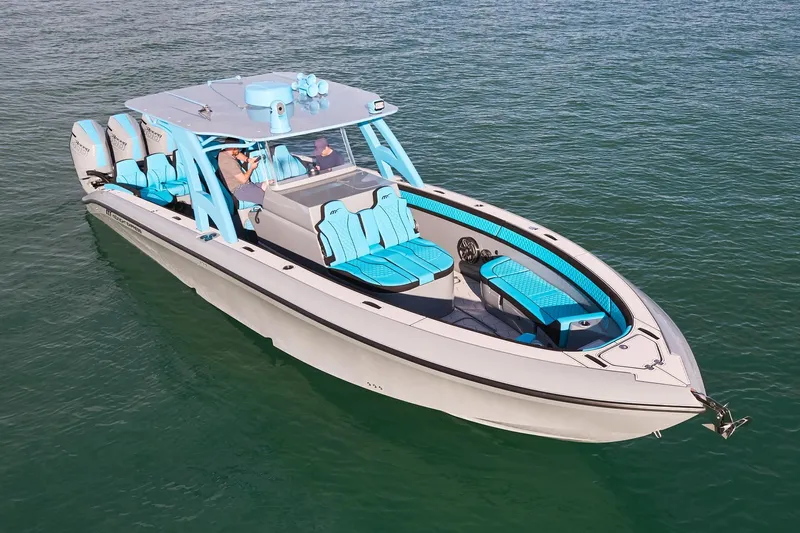  Yacht Photos Pics 2024 Midnight Express 37' Open boat with sleek design and vibrant blue seating.