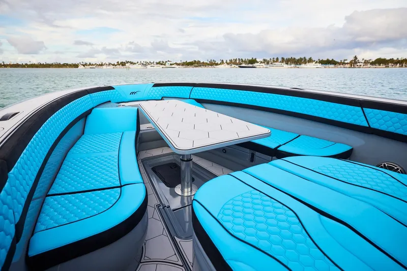  Yacht Photos Pics 2024 Midnight Express 37' Open boat with vibrant blue seating and sleek design.