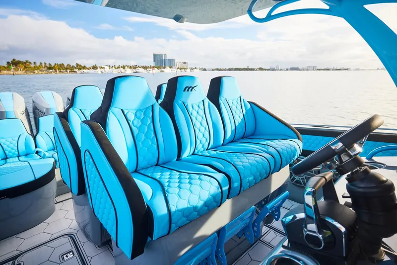  Yacht Photos Pics 2024 Midnight Express 37' Open boat with luxurious blue seating and modern design.