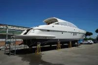 Custom HARD TOP 78 yacht under construction, 2025 model, elevated on stands outdoors.