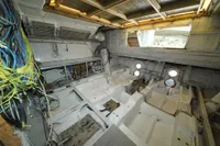 Interior of Custom HARD TOP 78 yacht under construction, showcasing wiring and structural elements.