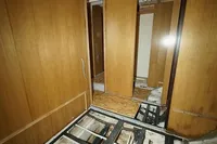 Under-construction interior of Custom HARD TOP 78 yacht, showcasing exposed framework and wooden panels.