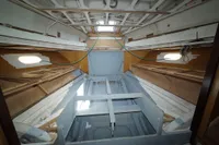 Interior of a Custom HARD TOP 78 yacht under construction, showcasing unfinished framework.