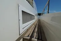 Side view of Custom HARD TOP 78 yacht under construction, showcasing deck and railing.