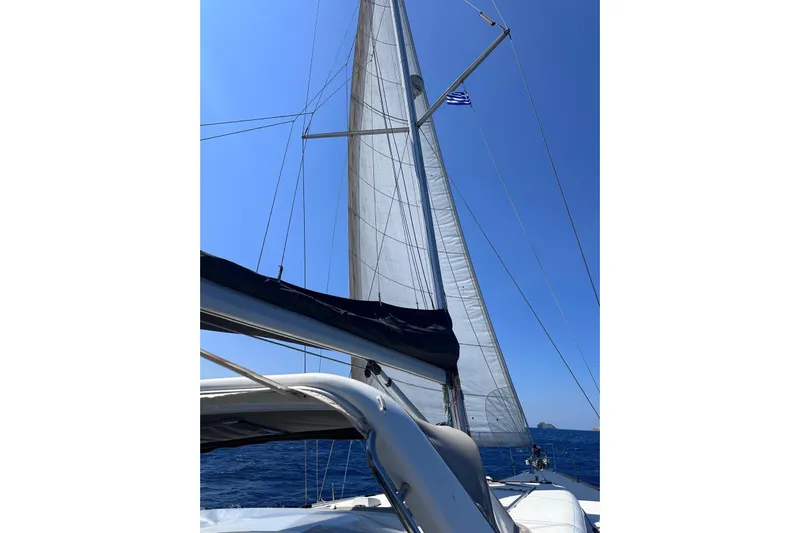 Boxter Yacht Photos Pics Sailing on a 2013 Beneteau Sense 50 yacht with clear blue skies.