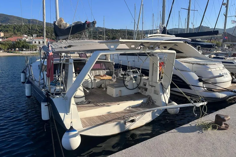 Boxter Yacht Photos Pics 2013 Beneteau Sense 50 yacht docked at marina, featuring spacious deck and modern design.