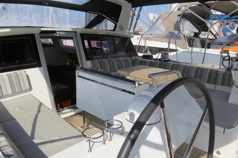 Boxter Yacht Photos Pics 2013 Beneteau Sense 50 yacht cockpit with seating and steering wheel.