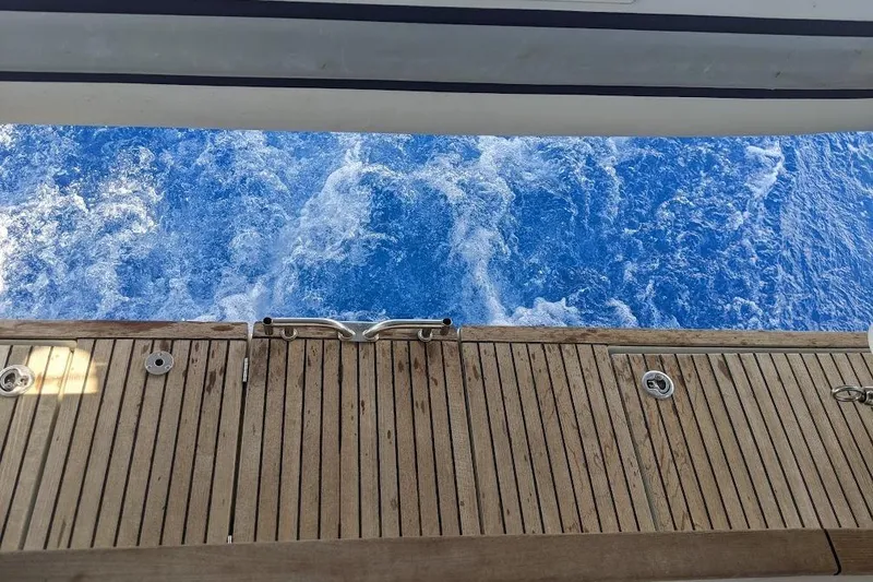 Boxter Yacht Photos Pics Beneteau Sense 50 yacht deck overlooking vibrant blue ocean waves, 2013 model.