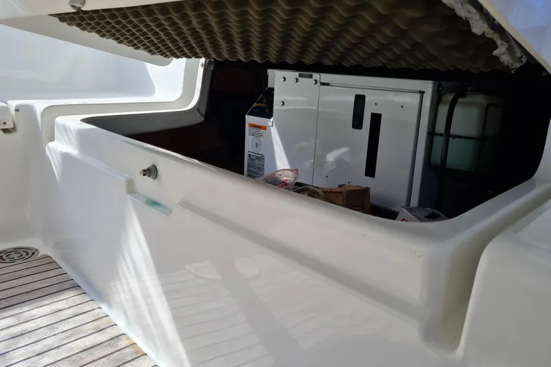 Boxter Yacht Photos Pics Storage compartment of a 2013 Beneteau Sense 50 yacht, featuring equipment and supplies.