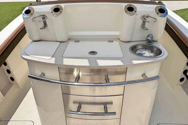  Yacht Photos Pics 2014 Scout 275 LXF boat interior with sink and storage drawers.