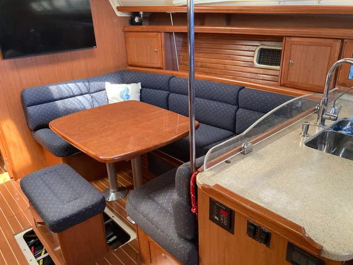 Fela Yacht Photos Pics 2009 Hunter 49 Aft Cockpit interior with dining area and kitchenette.