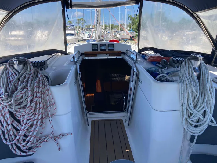 Fela Yacht Photos Pics 2009 Hunter 49 Aft Cockpit sailboat interior with ropes and marina view.