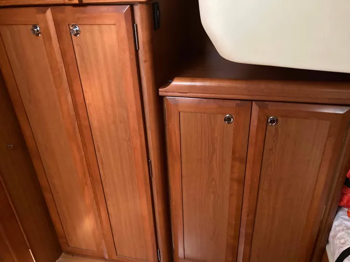 Fela Yacht Photos Pics Wooden cabinetry inside a 2009 Hunter 49 Aft Cockpit yacht interior.