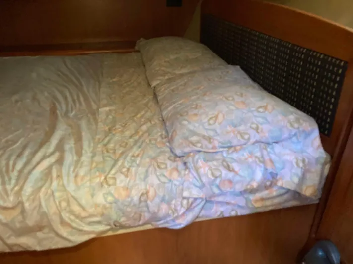 Fela Yacht Photos Pics Cozy bed in 2009 Hunter 49 Aft Cockpit yacht cabin with patterned bedding.