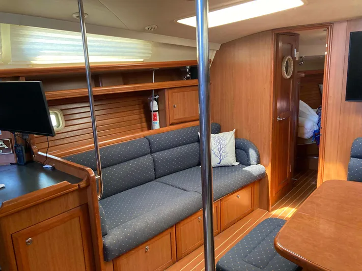 Fela Yacht Photos Pics 2009 Hunter 49 Aft Cockpit interior with cozy seating and wooden finishes.
