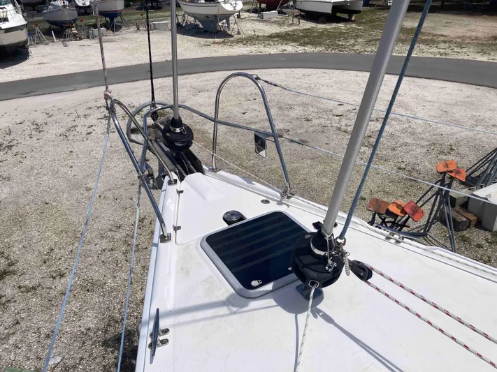Fela Yacht Photos Pics 2009 Hunter 49 Aft Cockpit sailboat deck with rigging and hatch, in a boatyard setting.