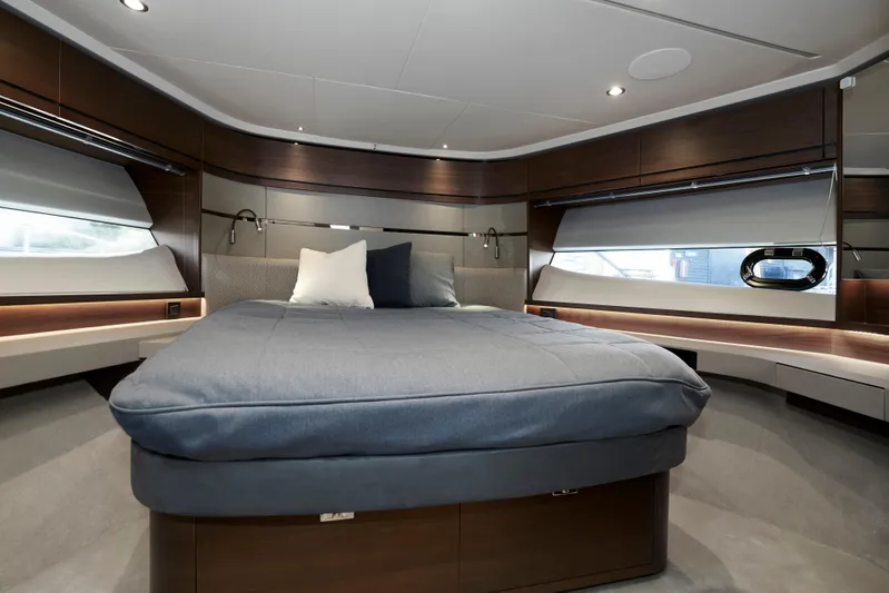  Yacht Photos Pics Luxurious bedroom interior of 2021 Princess S66 yacht with modern design and cozy bedding.