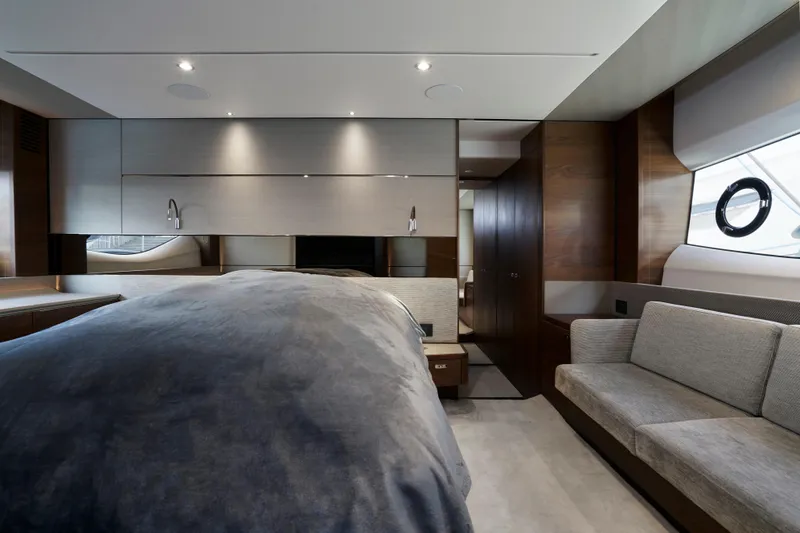  Yacht Photos Pics Luxurious interior of 2021 Princess S66 yacht with modern bedroom and seating area.